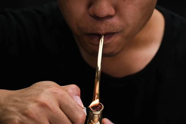 Asian Man Smokes Marijuana Pipe Home Studio Shoot Model Simulating — ストック写真