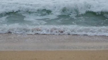 Beautiful sea waves and white sand beach in the tropical island. Beautiful view of the sunsets over sea. Ocean beach sunrise and dramatic colorful sky clouds
