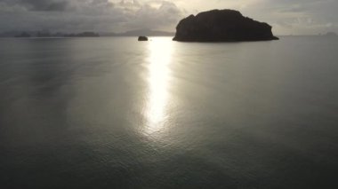 Aerial view from drones of fishing boats in the shore during low tide. Top view of many Thai traditional longtail fishing boats in the tropical islands. A lot of long tail boat on sea