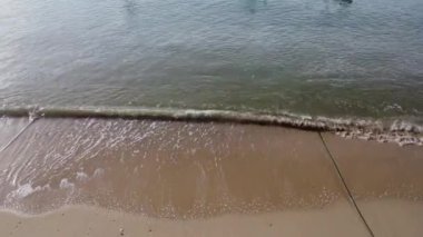 Aerial view from drones of fishing boats in the shore during low tide. Top view of many Thai traditional longtail fishing boats in the tropical islands. A lot of long tail boat on sea