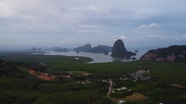 Aerial view of Samet Nangshe and mangrove forest at sunset in Phang Nga Bay in the Andaman Sea, Thailand. Travel and holidays vacation concept. Beautiful natural landscape background