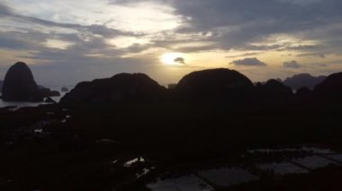 Aerial view of Samet Nangshe and mangrove forest at sunset in Phang Nga Bay in the Andaman Sea, Thailand. Travel and holidays vacation concept. Beautiful natural landscape background