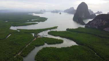 Aerial view of Samet Nangshe and mangrove forest at sunrise in Phang Nga Bay in the Andaman Sea, Thailand. Travel and holidays vacation concept. Beautiful natural landscape background