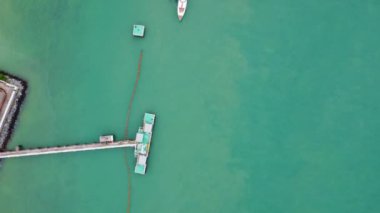 Aerial view from drone of commercial ship and cruise ship parked in the marina. Transportation and travel background, beautiful sea in summer.