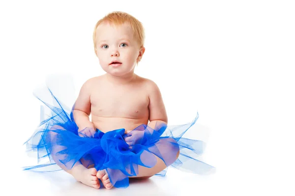 Cheerful little girl in a blue skirt — Stock Photo, Image