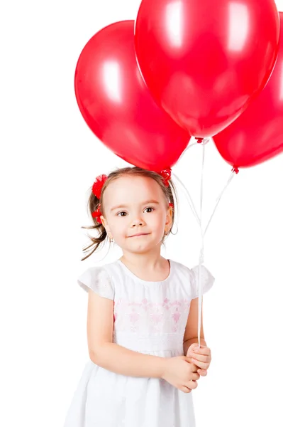 Lilla flickan med de röda ballongerna — Stockfoto