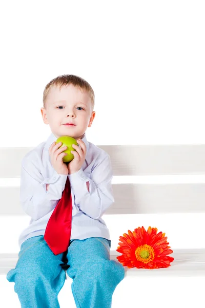Little boy with an apple — Stock Photo, Image