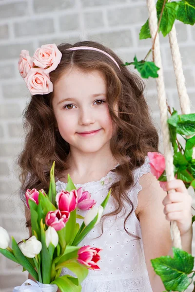 Portrait of a beautiful girl with tulips — Stock Photo, Image