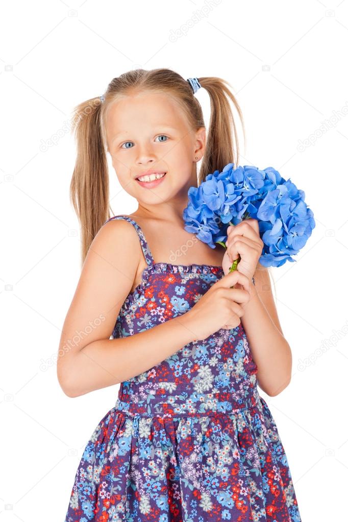 Beautiful girl with a bouquet of blue hydrangeas
