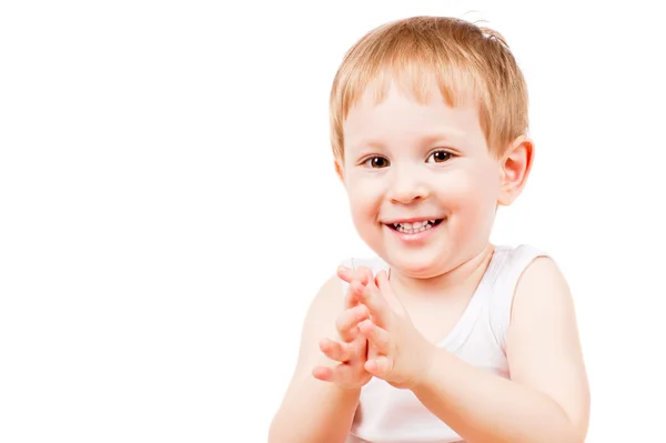 Sonriente niño aplaude sus manos — Foto de Stock