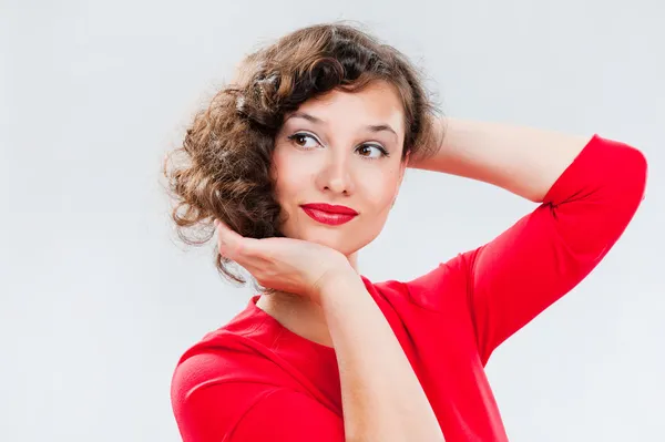 Portrait of a beautiful girl on a gray background — Stock Photo, Image