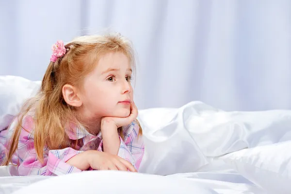 Little girl on the bed — Stock Photo, Image