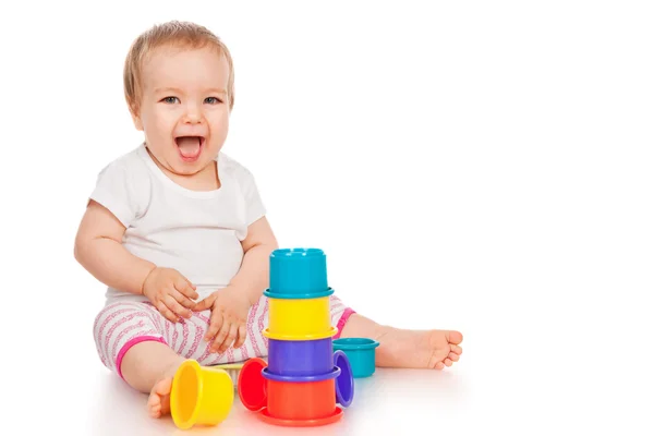 Little girl with toys — Stock Photo, Image