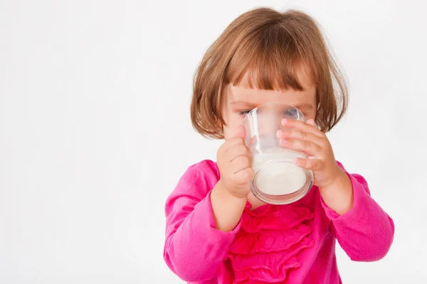 Little girl drinking milk — Stock Photo, Image
