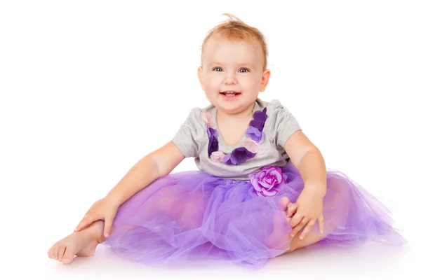 Alegre niña en una falda morada —  Fotos de Stock