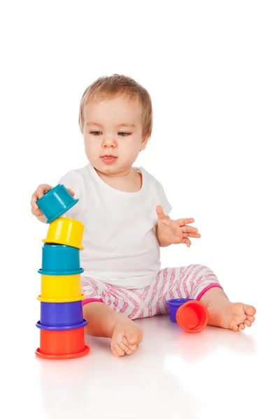 Little girl with toys — Stock Photo, Image