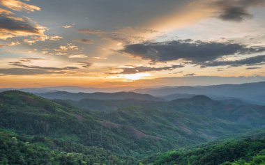 Colorful sunset over the mountain hills Thailand.