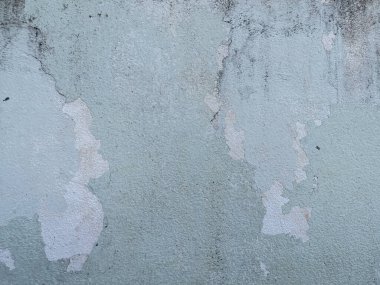 A cracked concrete wall covered with a gray cement texture as the background. and enter text