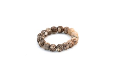 Closeup of stone bracelets isolated on white background.