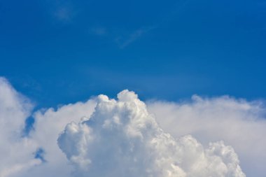 Blue sky and white clouds, the freshness of the new day. The bright blue background gives a feeling of relaxation as in the sky, the scenery of the blue sky and the light of the sun.