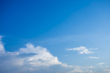 Blue sky and white clouds, the freshness of the new day. The bright blue background gives a feeling of relaxation as in the sky, the scenery of the blue sky and the light of the sun.