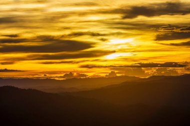 Colorful sunset over the mountain hills Thailand