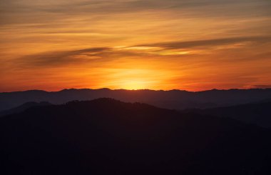 Colorful sunset over the mountain hills Thailand