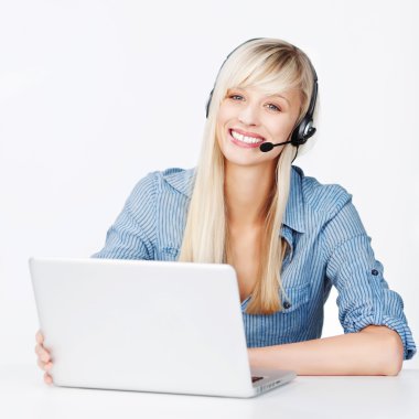 Smiling woman with a notebook and headset clipart