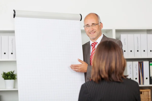 Businessman Giving Presentation To Female Coworker — Stock Photo, Image