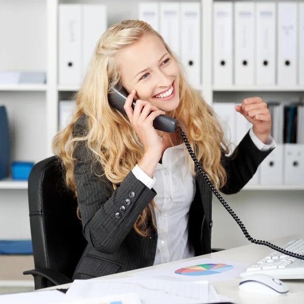Businesswoman With Clenched Fist Communicating On Landline Phone — Stock Photo, Image