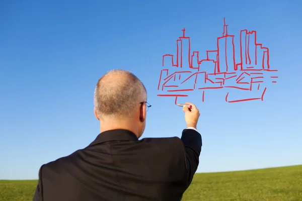 Businessman Drawing Buildings On Sky — Stock Photo, Image
