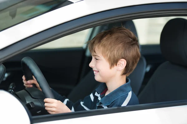 Driving little boy — Stock Photo, Image