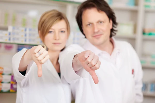 Pharmacists showing thumbs down — Stock Photo, Image