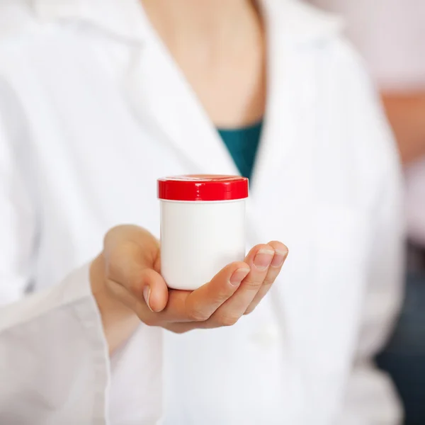 Female Pharmacist Holding Medicine Bottle — Stock Photo, Image