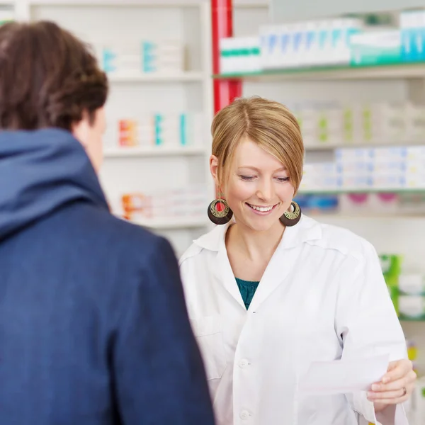 Pharmacist advising costumer — Stock Photo, Image