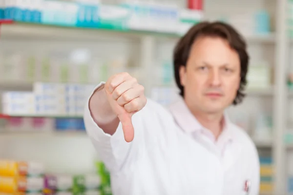Pharmacist showing thumbs down — Stock Photo, Image