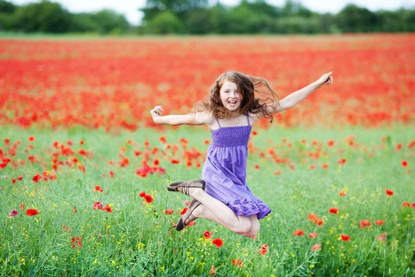 Young girl jumping for joy — Stock Photo, Image