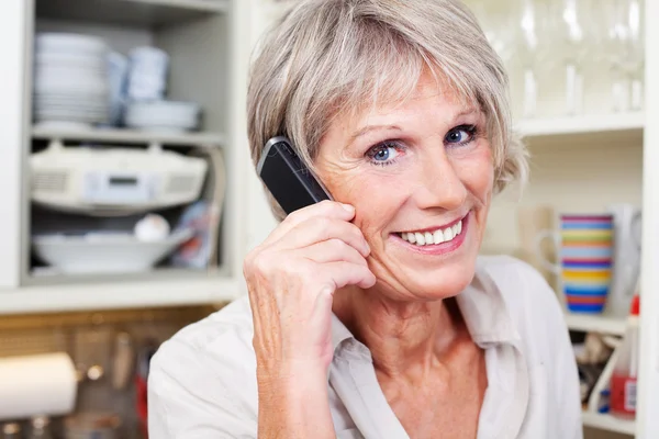 Active senior woman on the telephone Stock Image
