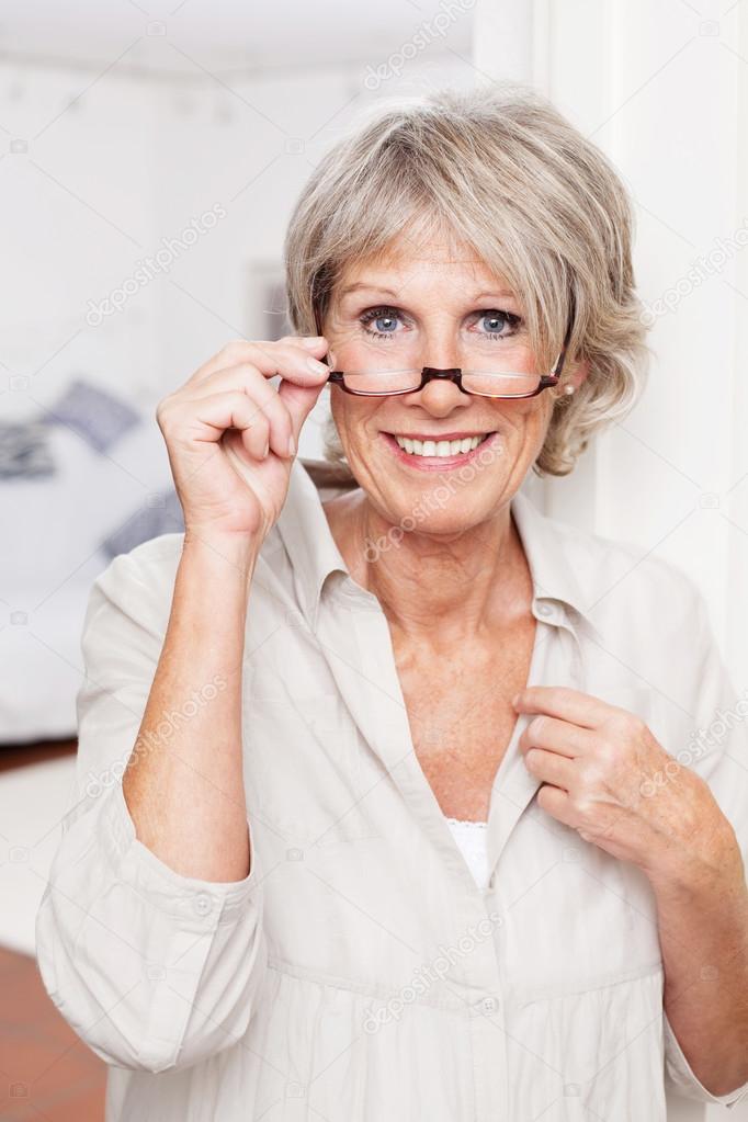 Elderly lady with reading glasses Stock Photo by ©racorn 25895545