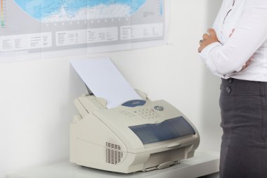 Businesswoman Wait For Fax clipart
