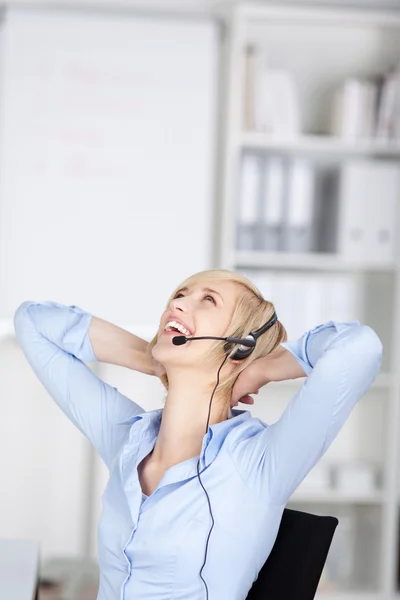 Happy woman using headset — Stock Photo, Image
