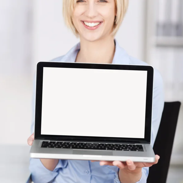 Businesswoman Displaying Laptop In Office — Stock Photo, Image