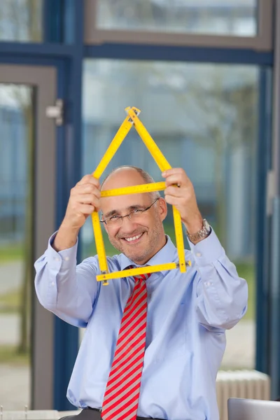 Architect Holding House Made Of Ruler — Stock Photo, Image