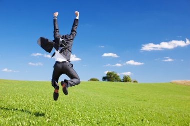 Businessman jumping for joy clipart