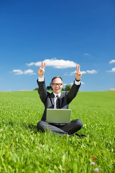 Triumphant man giving a victory sign — Stock Photo, Image