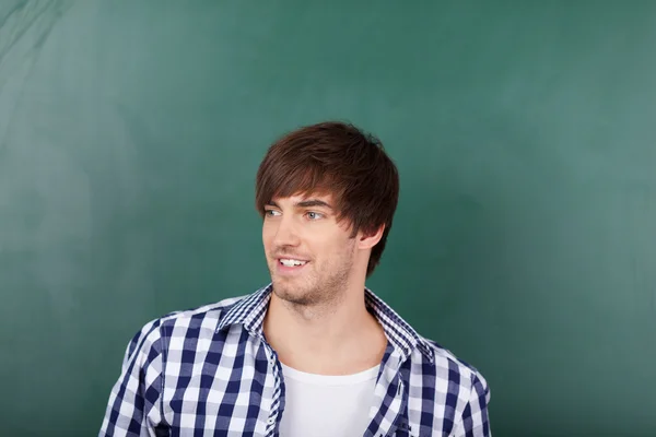 Male Teacher In Front Of Chalkboard — Stock Photo, Image