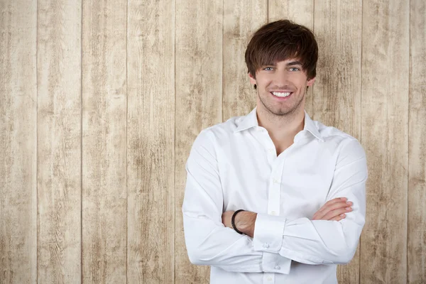 Businessman With Arms Crossed Standing Against Wooden Wall — Stock Photo, Image