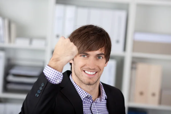 Businessman With Clenched Fist In Office — Stock Photo, Image