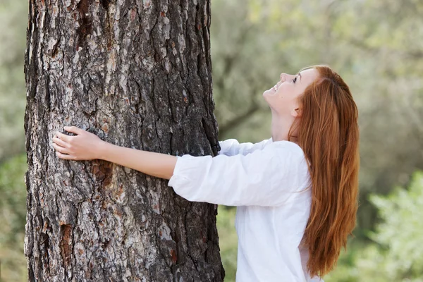 Beautiful woman showing her love of nature — Stock Photo, Image