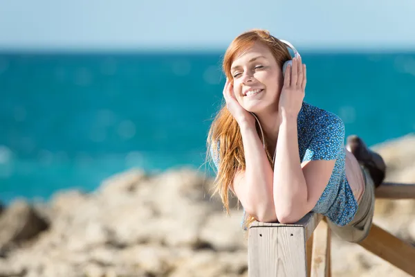 Listening to music at the sea — Zdjęcie stockowe